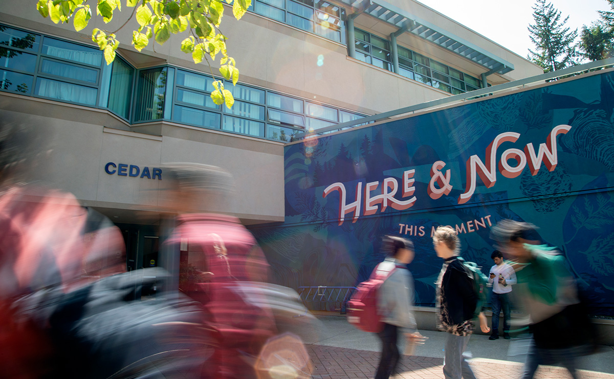 Students in front of Here and Now mural