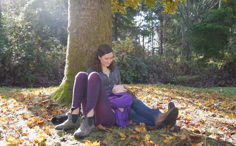 Emily Solomon under a tree with her daughter