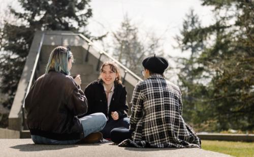 CapU students having a conversation outside the Birch Building on North Vancouver Campus