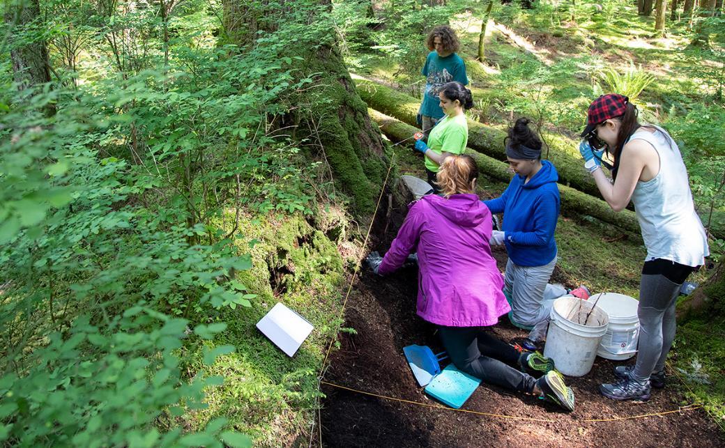 Students outside planting
