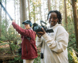 CapU Outdoor Filmmaking students using a camera and boom microphone on a shoot in Squamish.