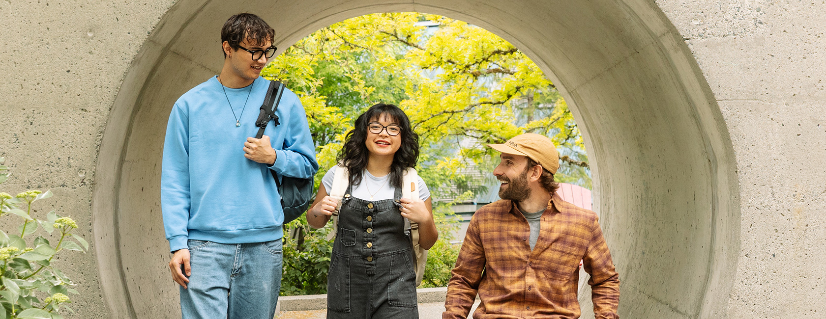 Three CapU students in front of Birch Building at the North Vancouver Campus.