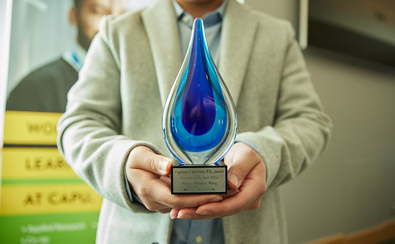 Photo of Simon Wang's award