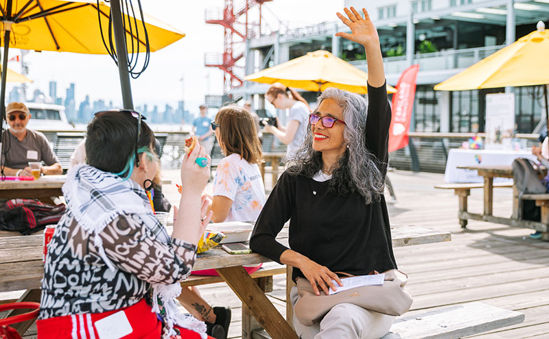 Students and faculty at alumni event