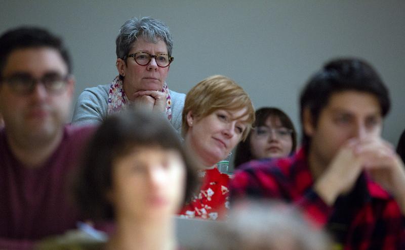 Faculty listening to presentation