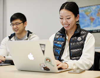 CapU LAA students working on a project.