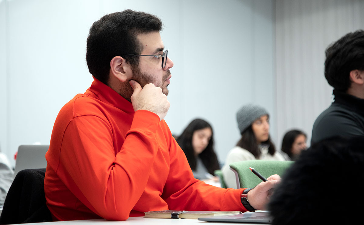 Student in classroom listening to teacher