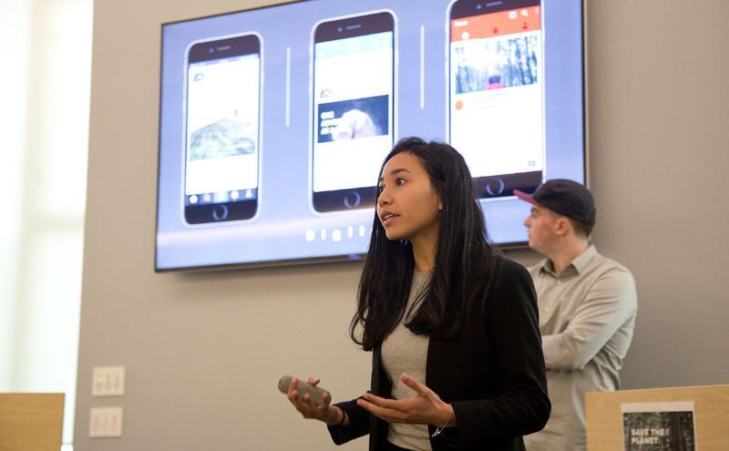 Student in front of class presenting project