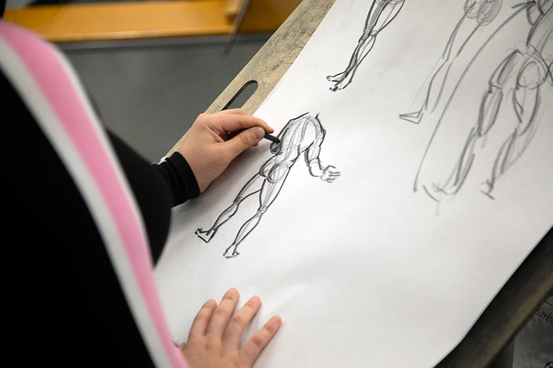 A 2D Animation student practices life drawing.