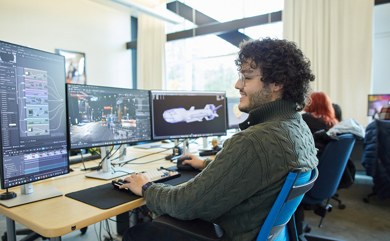 CapU student working at a 3D and VFX terminal.