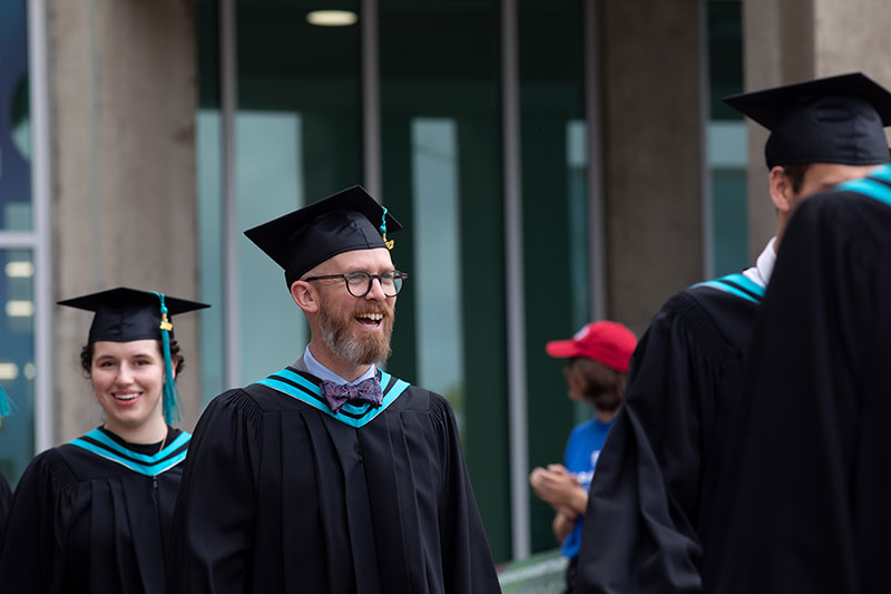 Bowtie-wearing CapU student at convocation.