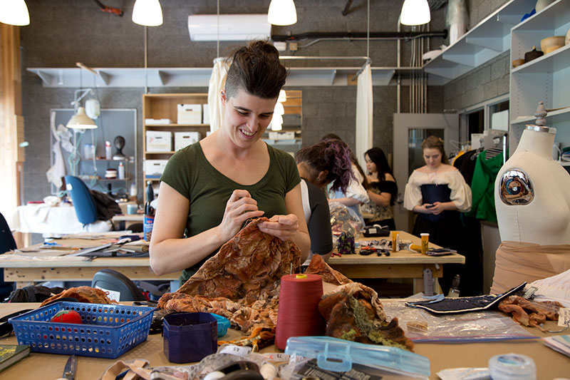 CapU Costuming student works on sewing their project.