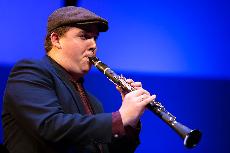 Jazz Studies student playing a clarinet at a concert.