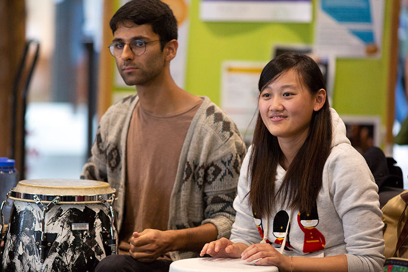 Students enjoy a drum circle.