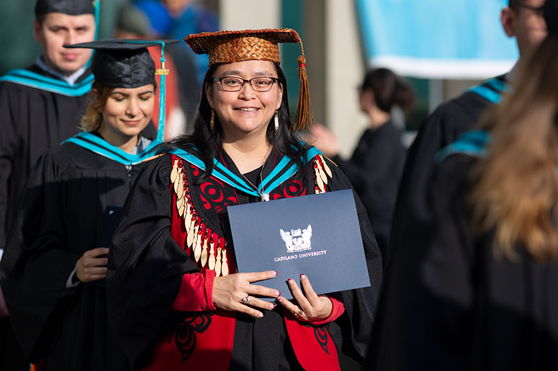 CapU student at their Convocation ceremony after graduating.