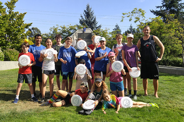 A photo of kids at a CapURec Ultimate Frisbee camp.