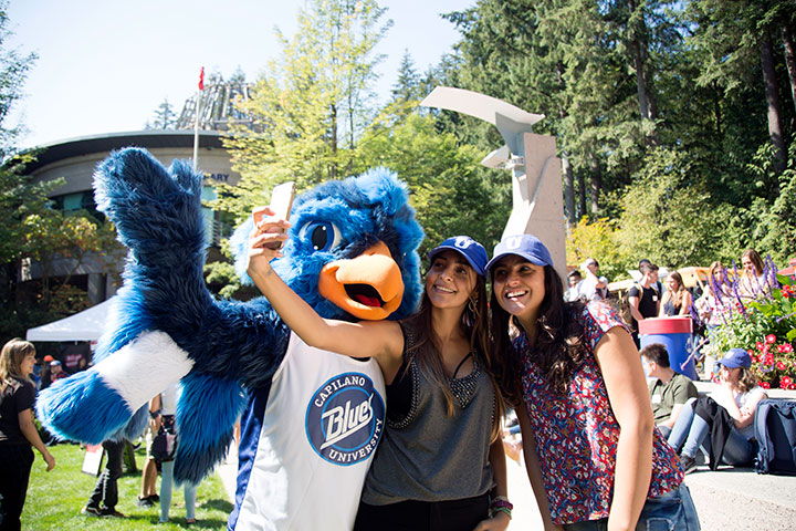 CapU Blues mascot Jay with students.