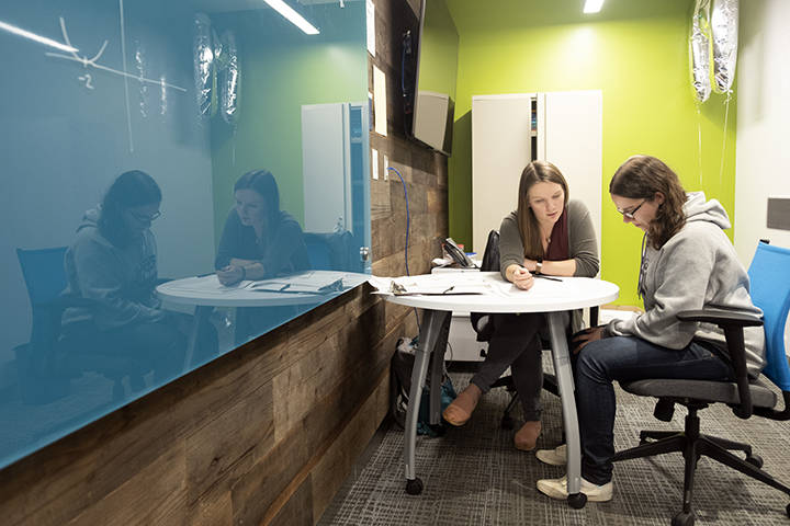 Instructor helping student in Learning Commons