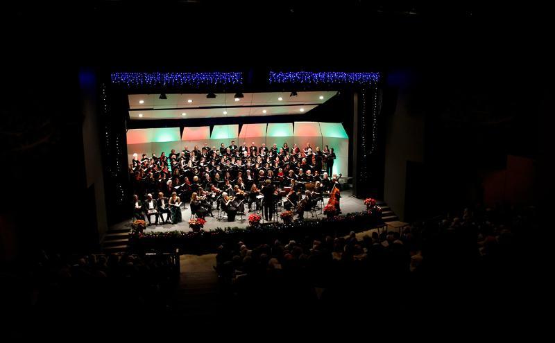 CapU Singers and the Capilano University Festival Chorus performing a live choral concert at the CapU Centre for Performing Arts.