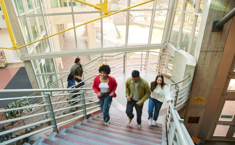CapU students ascending the staircase in Birch Building. 