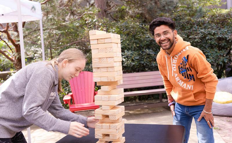 Students at Orientation playing a game of Jenga