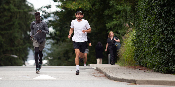 Student running on campus