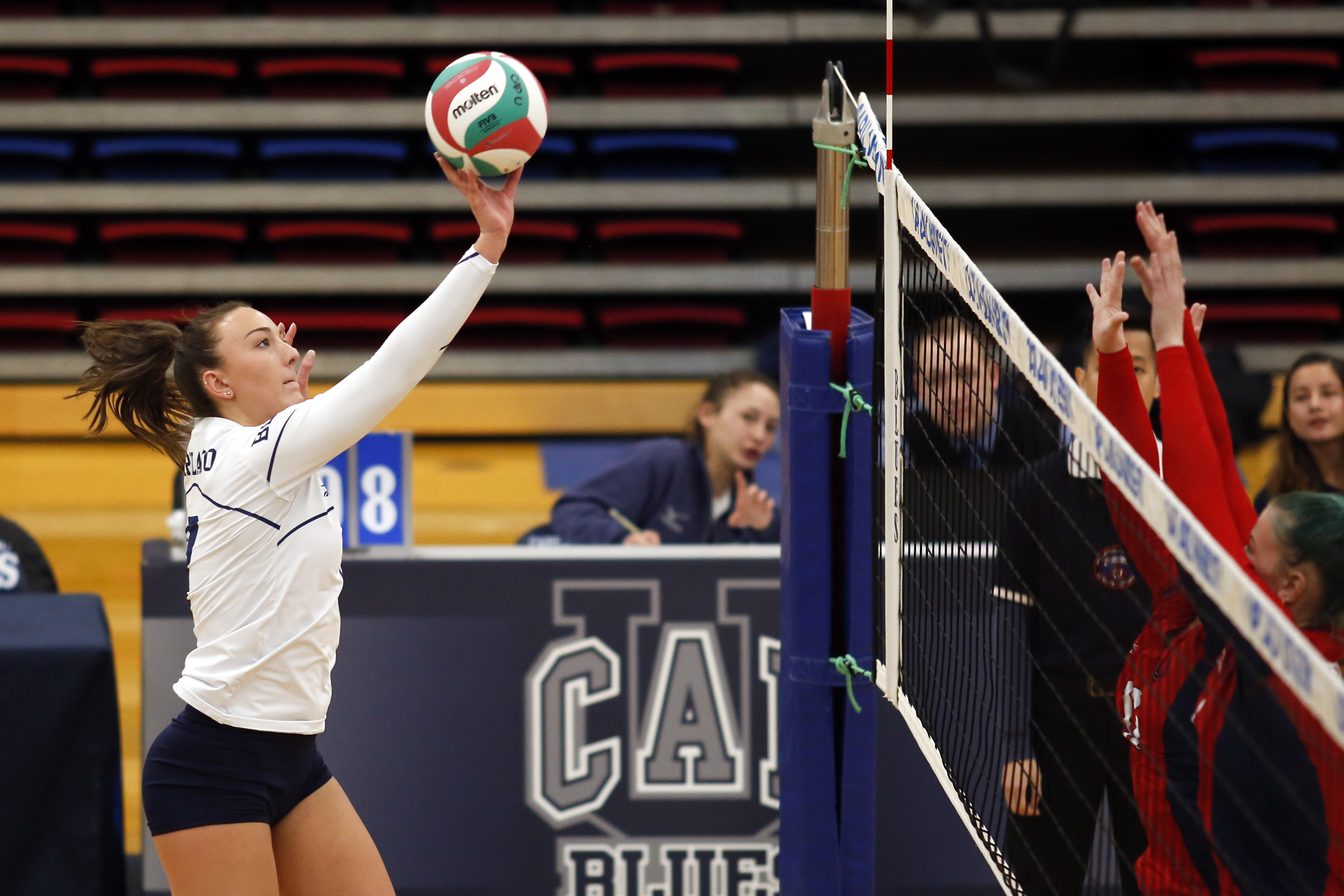A person is playing volleyball