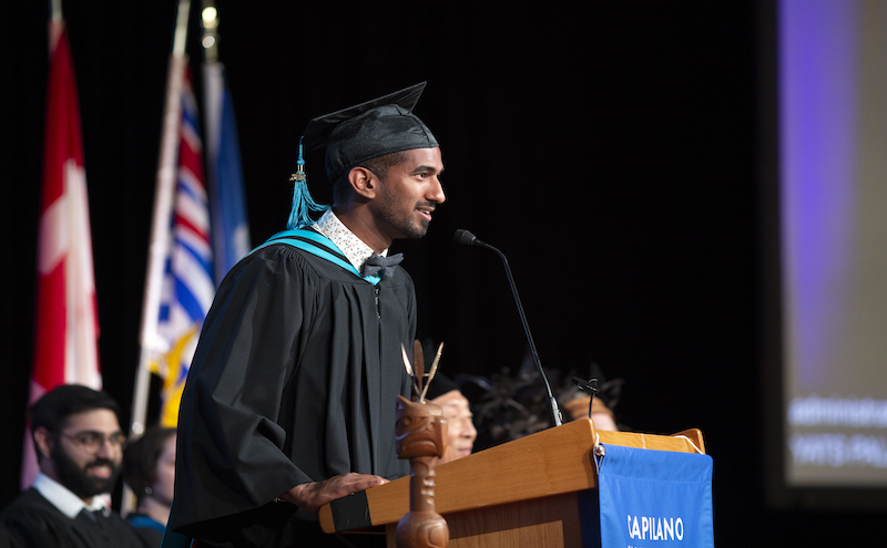 A student addressing an audience at convocation