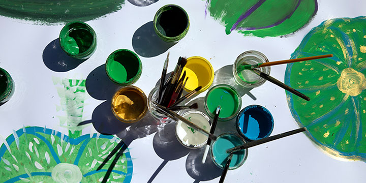 Open cans of paint on a table