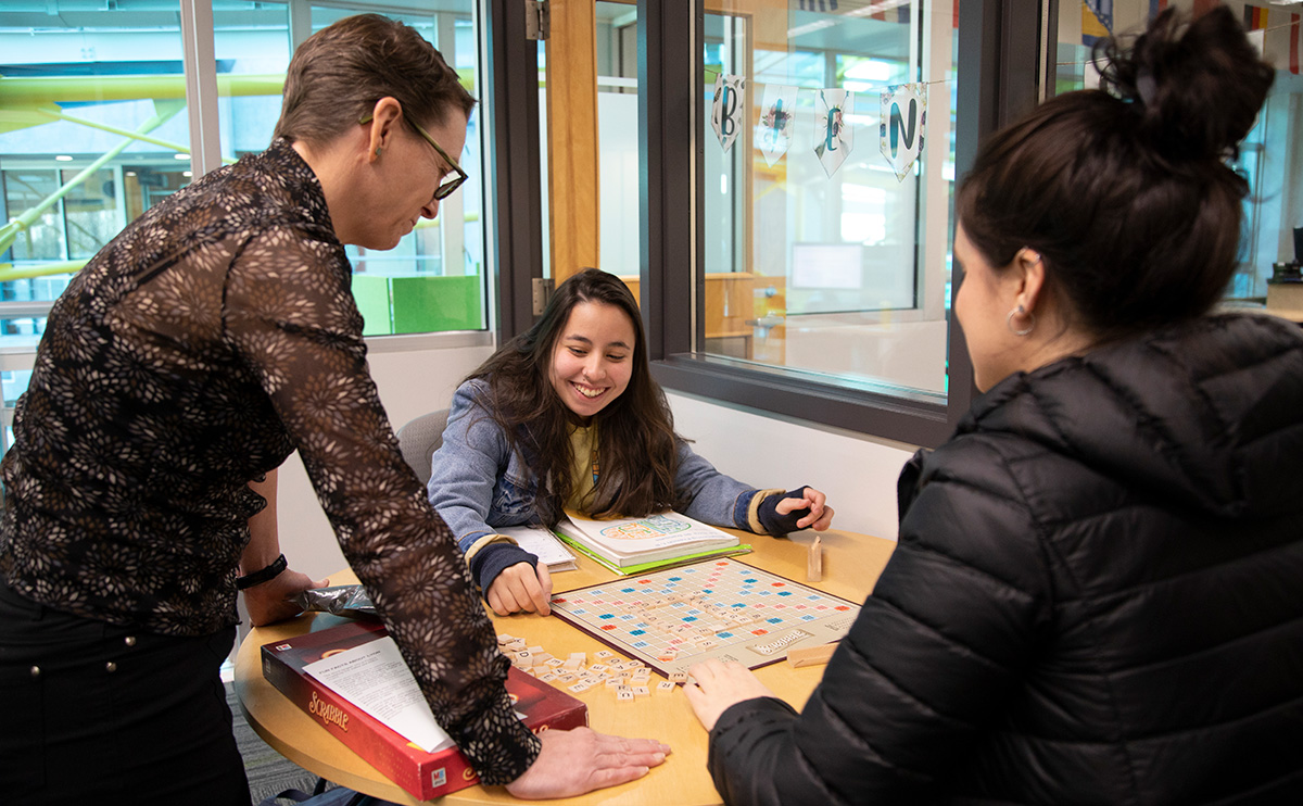 Students in Language Resource Centre playing Scrabble