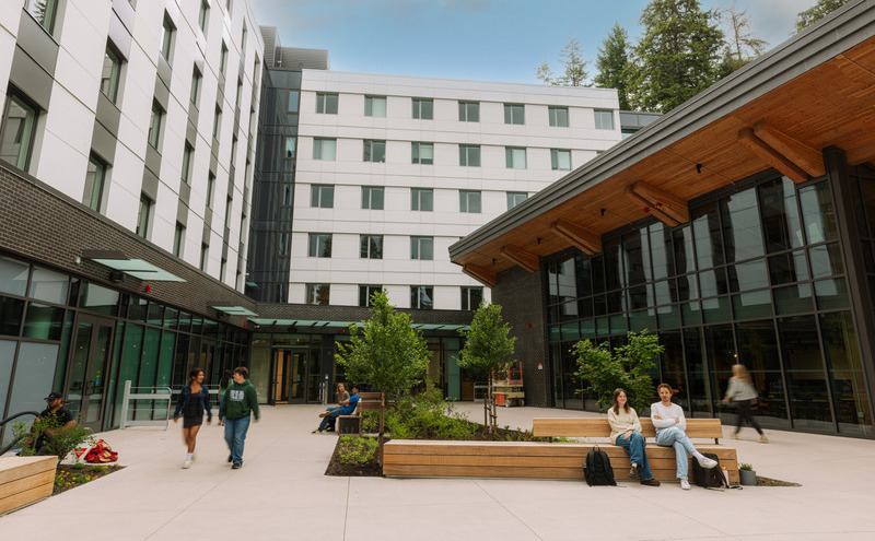 Students walking outside the Treehouse building
