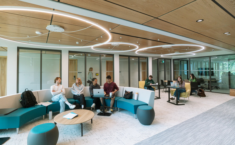 students hanging out with friends in the common area