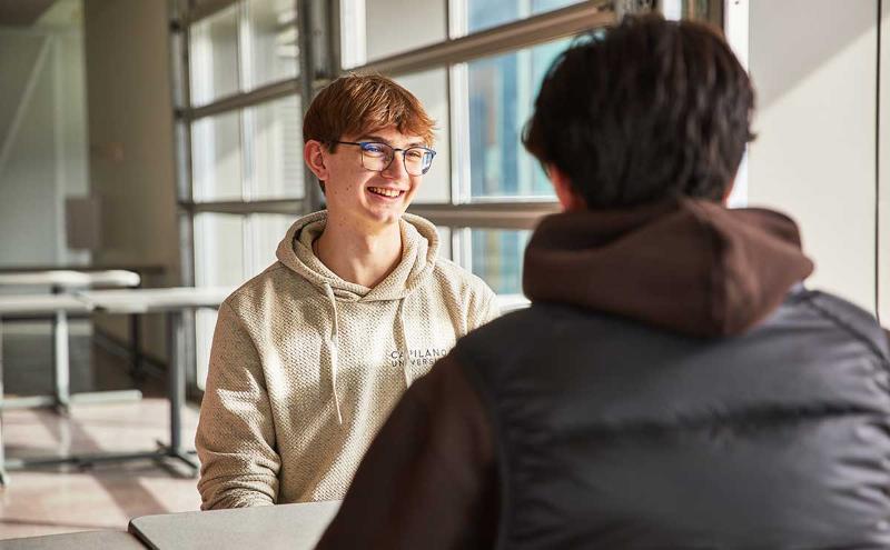 CapU students chatting in the Squamish cafeteria. 